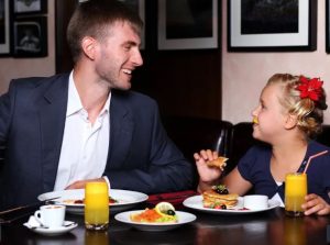 father-daughter-having-breakfast