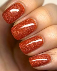 πορτοκαλί νύχια με glitter