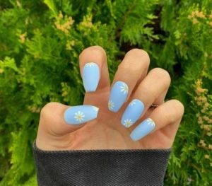 Blue manicure with flowers